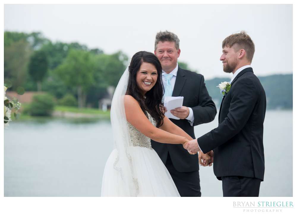 bride laughing at groomsmen prank
