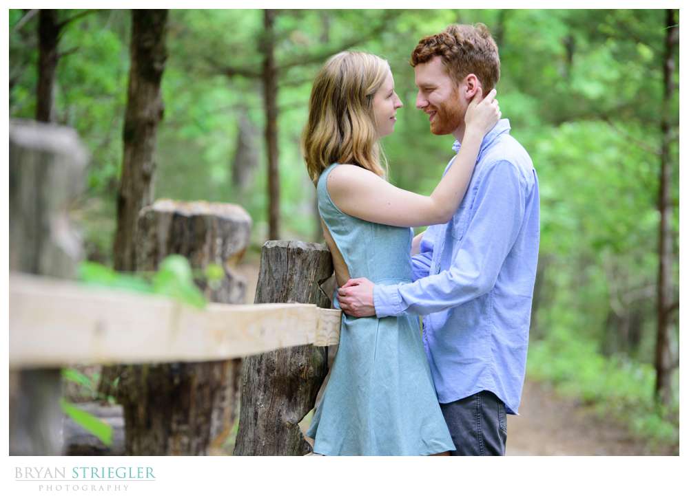 leaning against railing for engagements