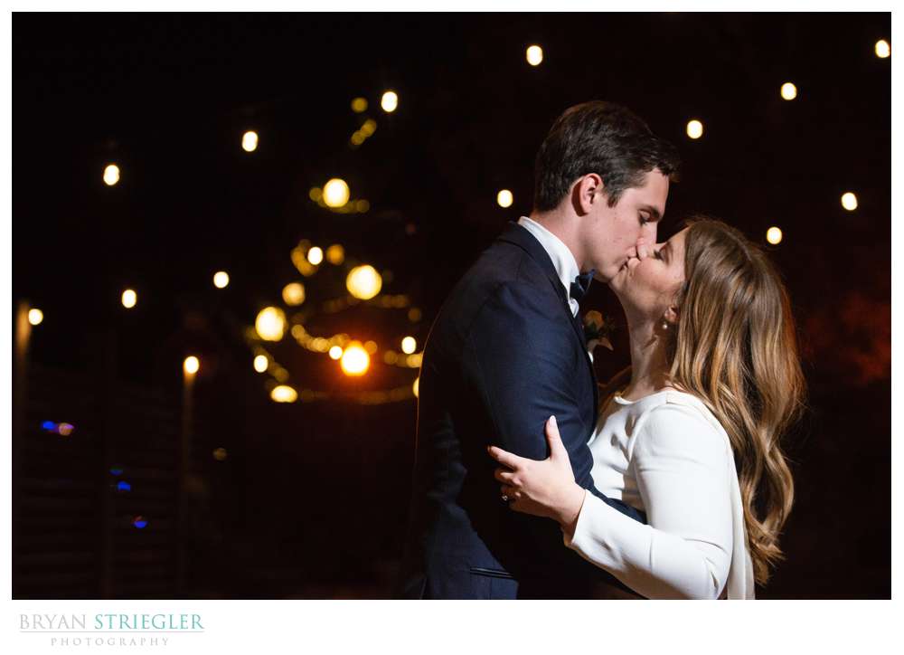 couple in courtyard of the Ravington with christmas lights