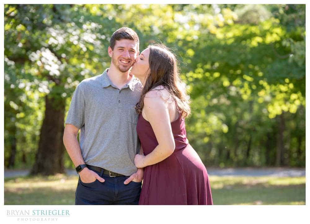 kissing fiance on the cheek