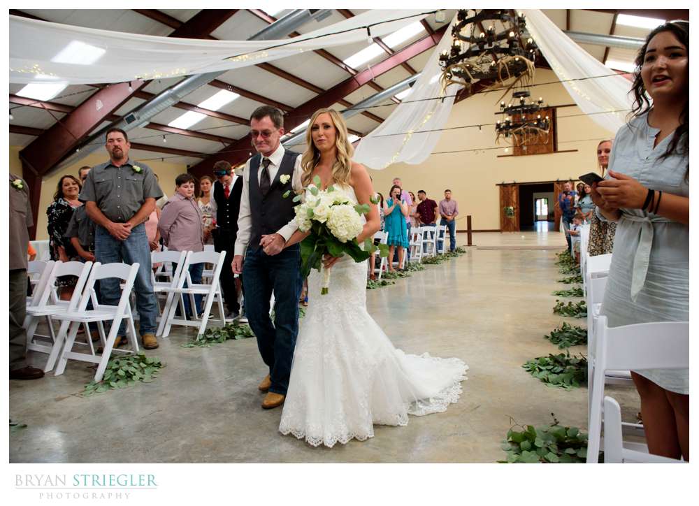 bride walking down the aisle at Rockford Grange