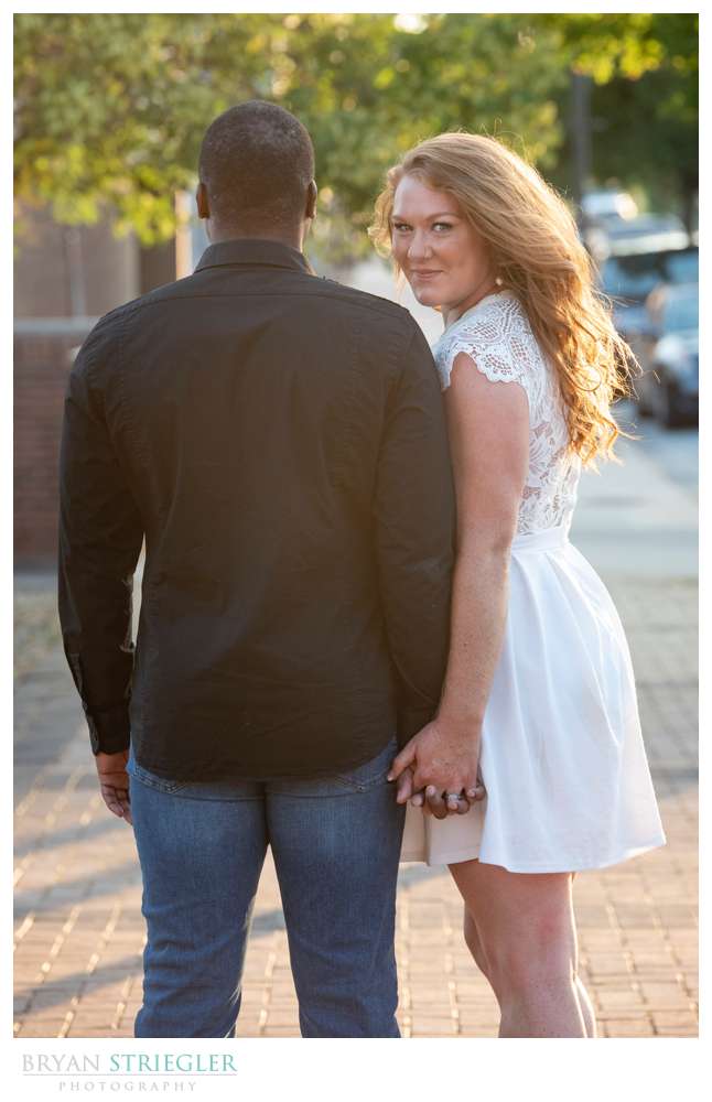 girl looking over guys shoulder