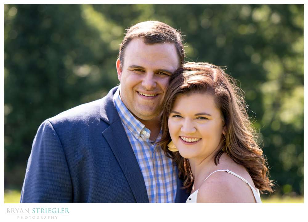 engagement photo with couple smiling