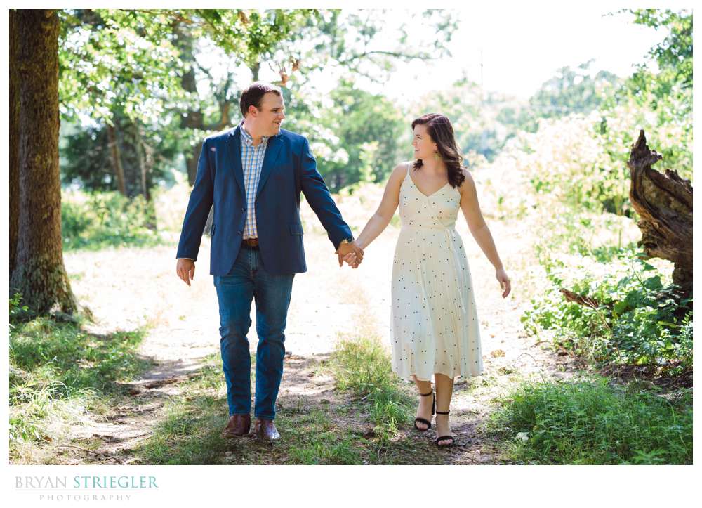 couple walking in woods