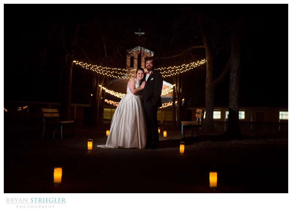 wedding couple in front of christmas lights