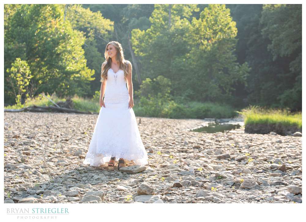 bride walking in creek bed