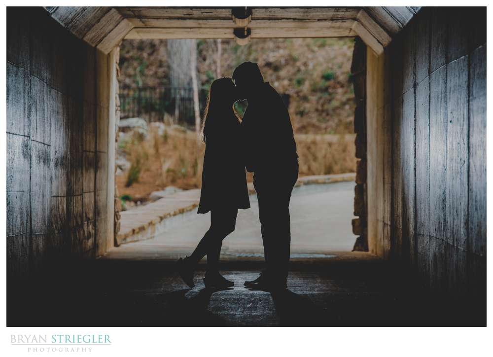 silhouette engagement photo in tunnel