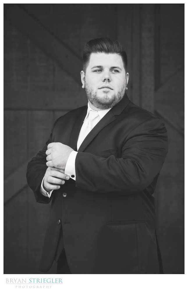black and white groom portrait