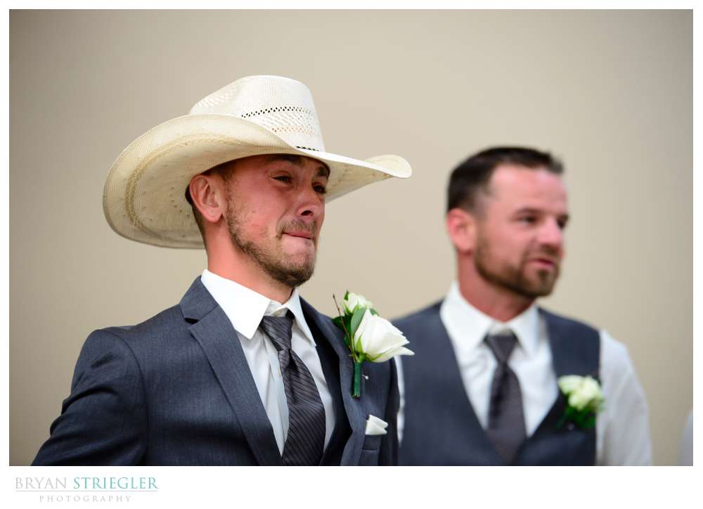 groom crying when seeing the bride