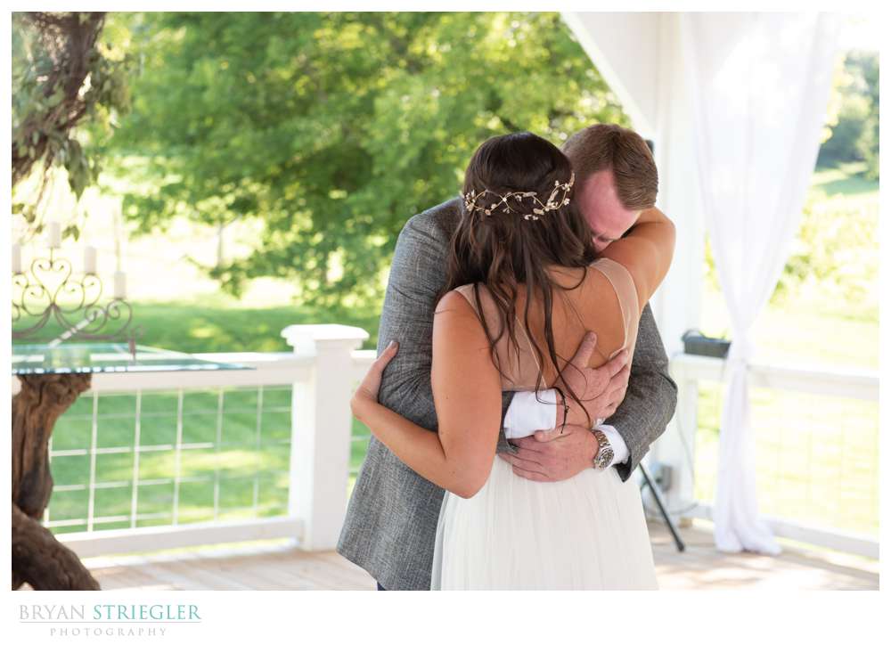 groom getting emotional during first look