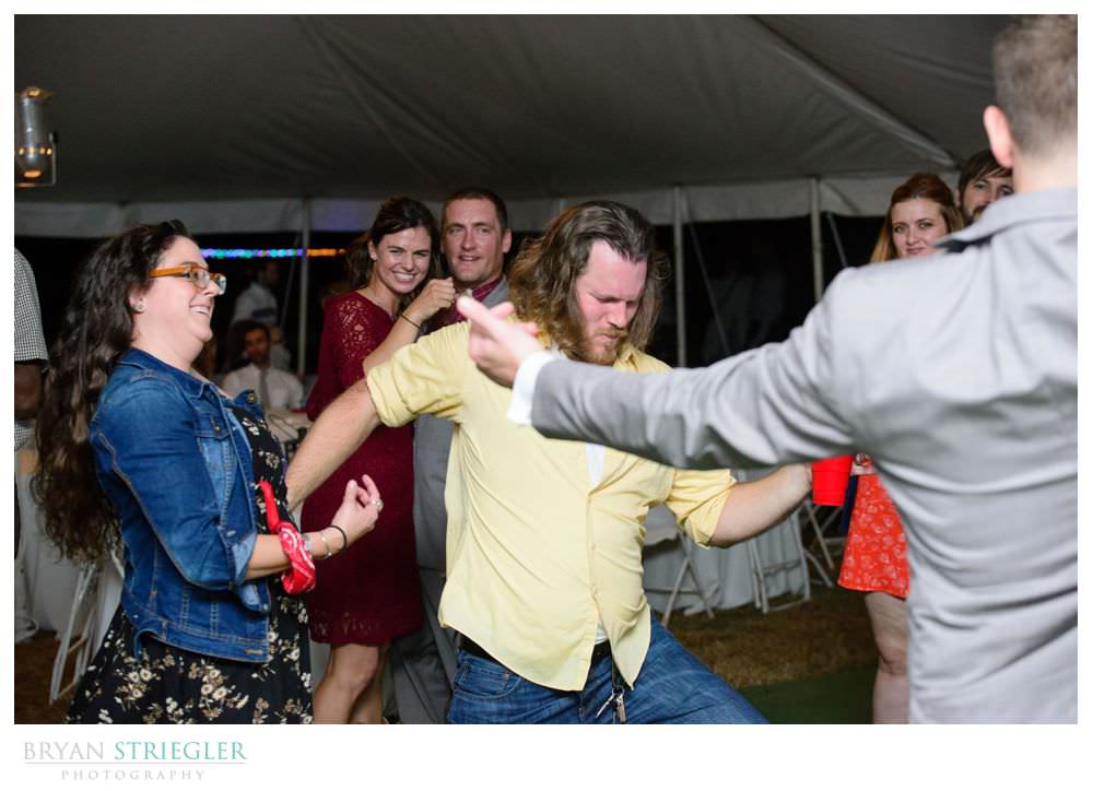 wedding guest doing an air guitar