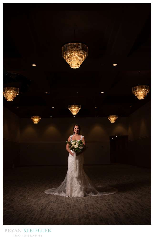 dramatic bridal portrait with chandeliers