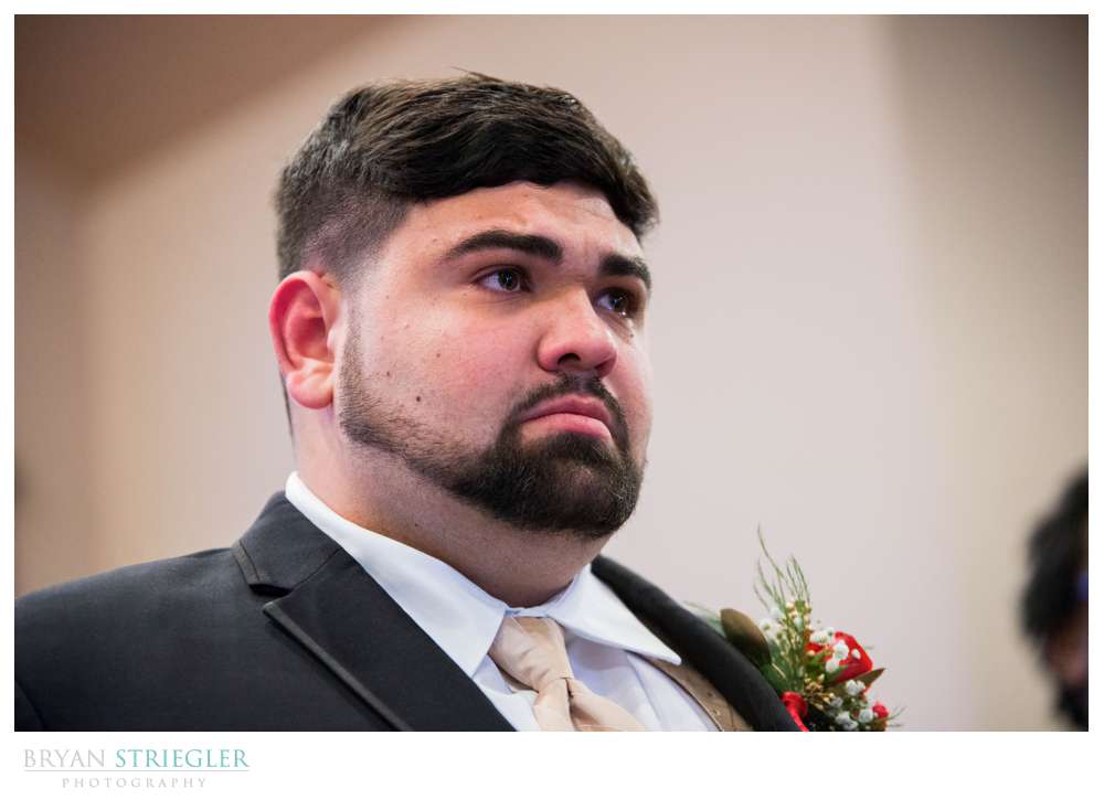 groom crying when seeing bride