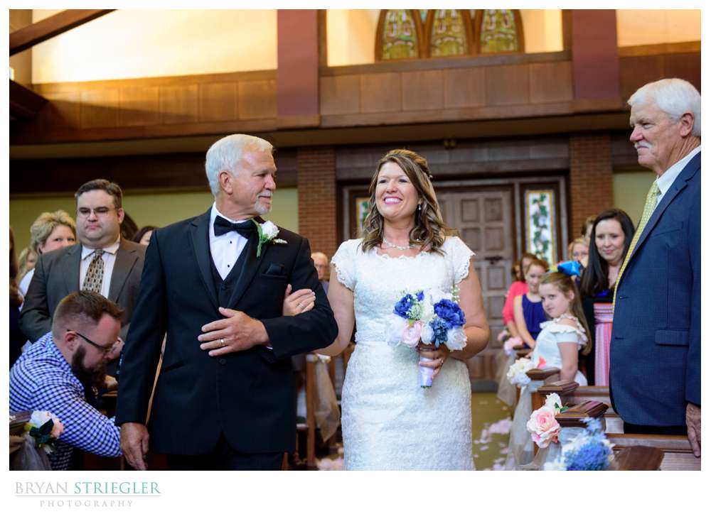 bride coming down the aisle in Van Buren