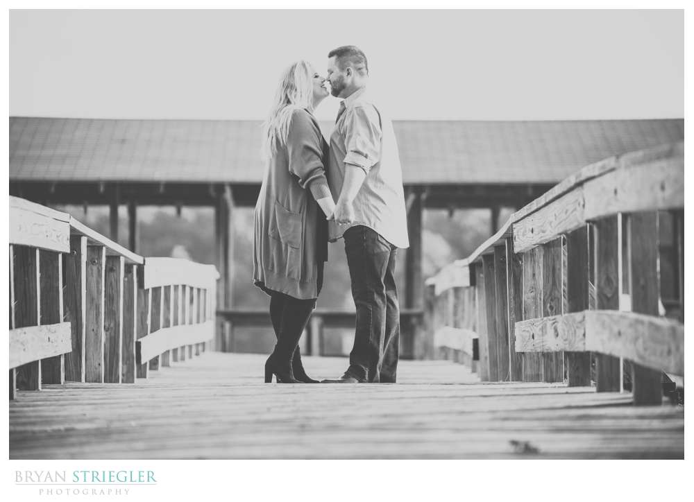 kissing on dock at Lake Fayetteville