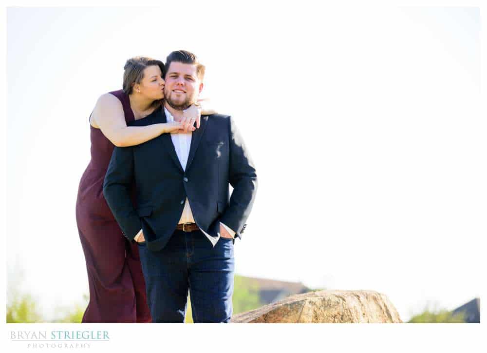 hugging fiance from behind