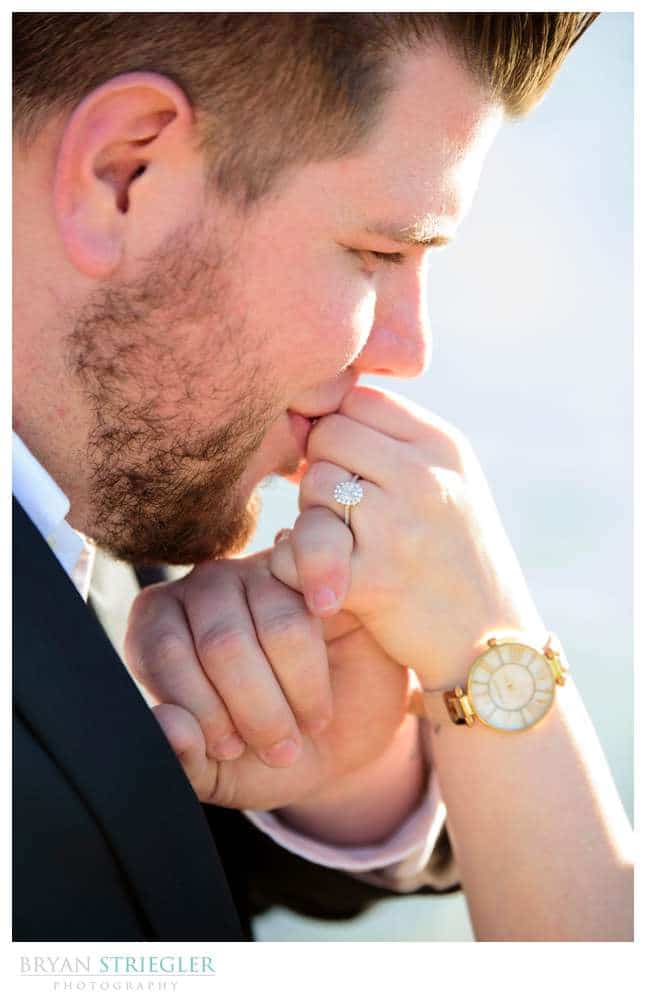 kissing hand with engagement ring