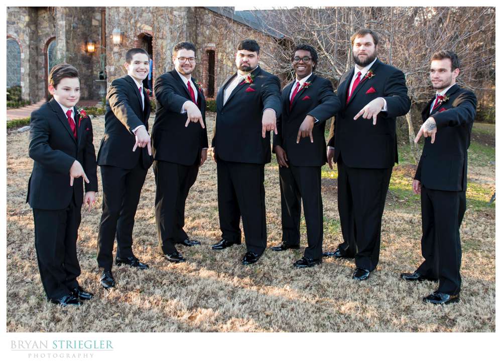 groomsmen doing horns down