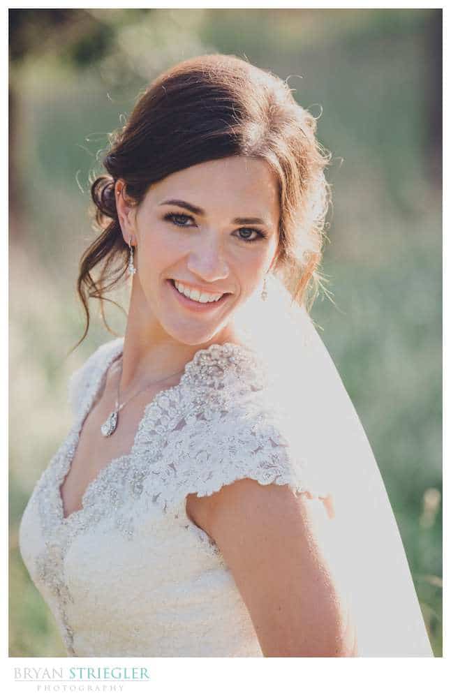 bride in a field with backlight