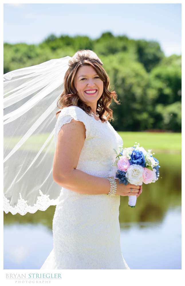 bridal portrait by pond in Van Buren