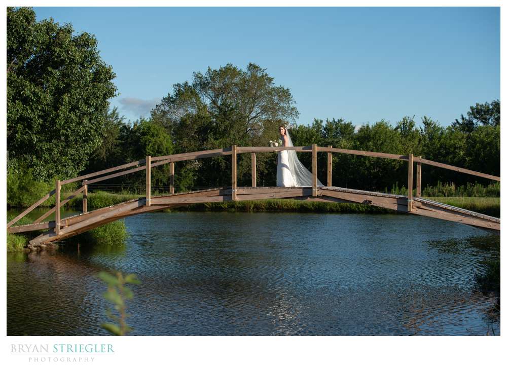 bride on bridge at the Orchard