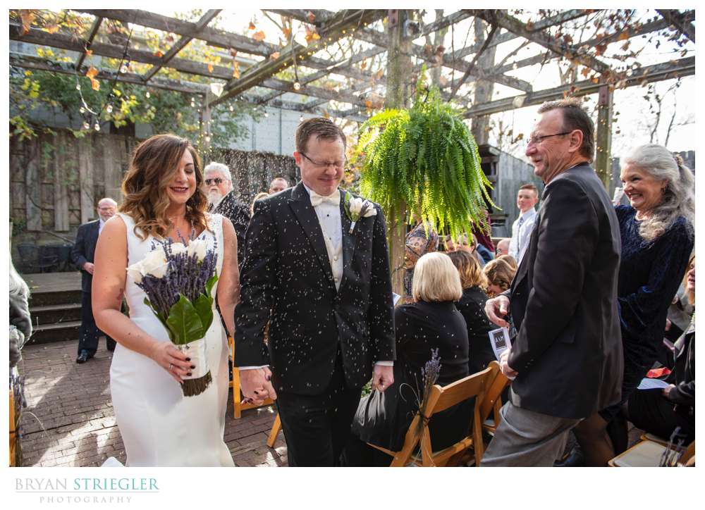 groom getting hit in face with rice