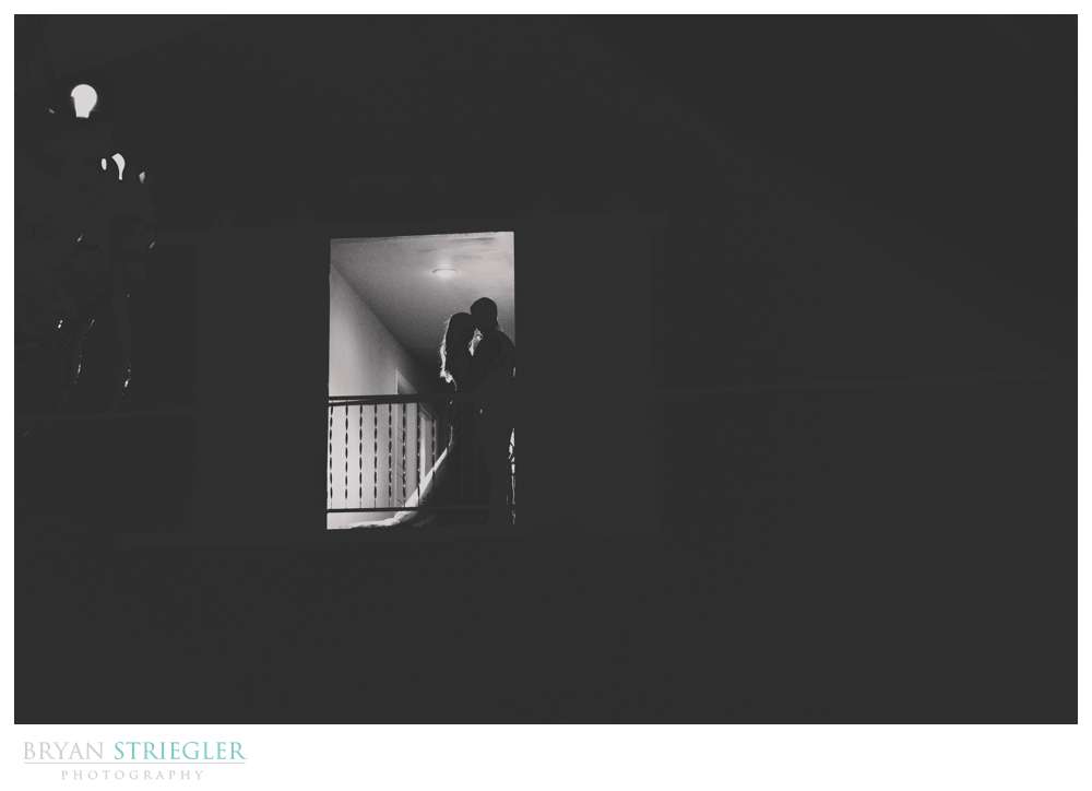 bride and groom on balcony at Rockford Grange