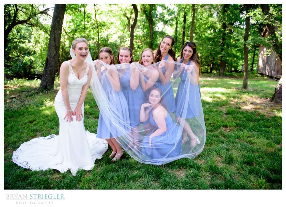 bridesmaid hiding under veil