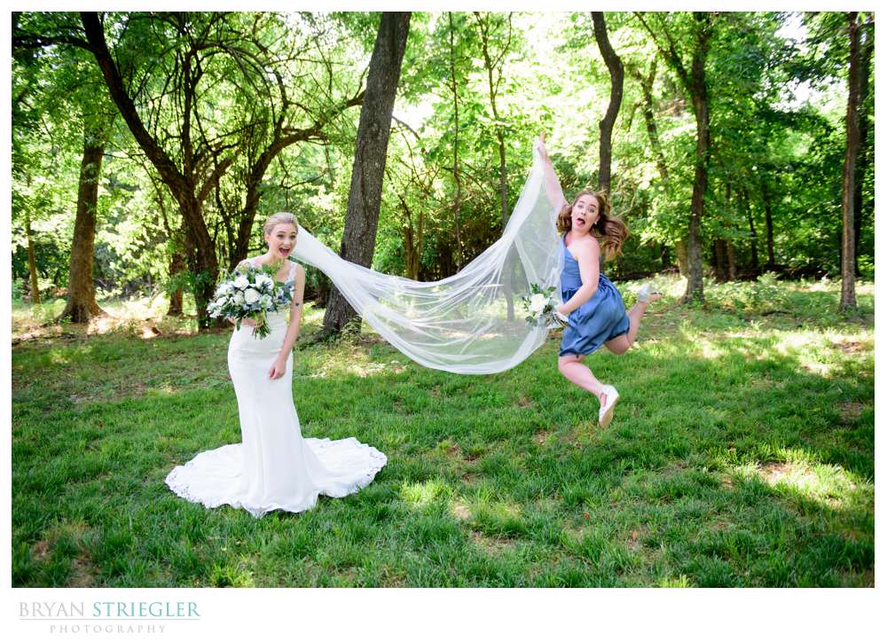 bridesmaid jumping with vail