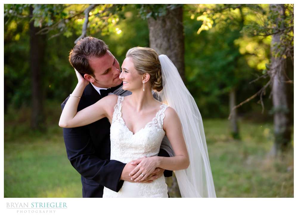 groom hugging bride