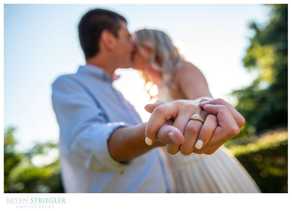 showing off engagement ring