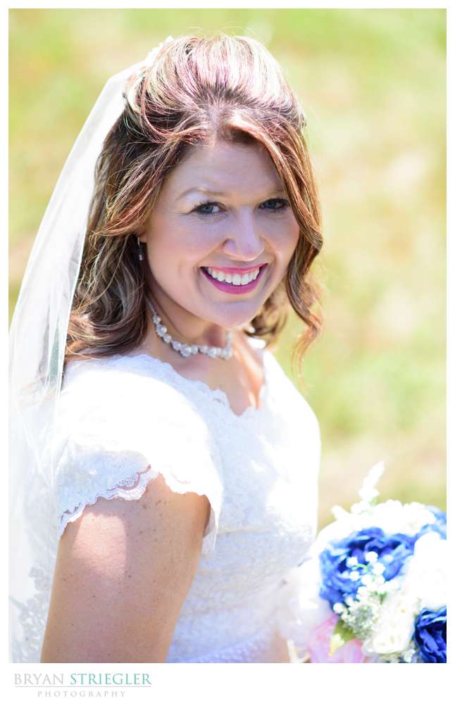 bridal portrait by pond in Van Buren
