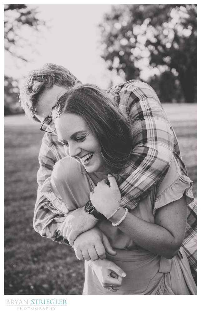 laughing and hugging engagement photo