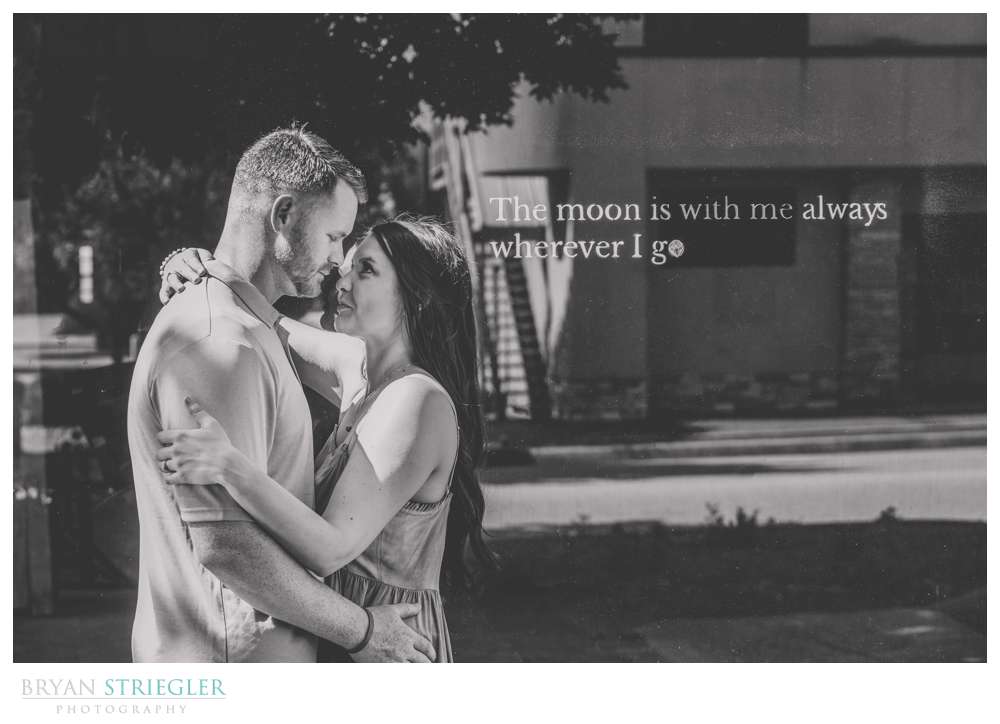 engagement photo with text on wall
