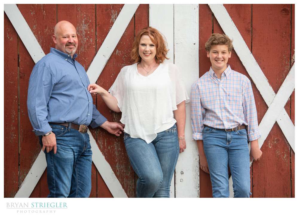 engagement photo in front of barn door
