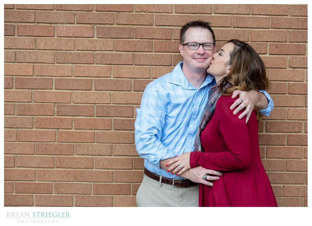 engagement photos by brick wall