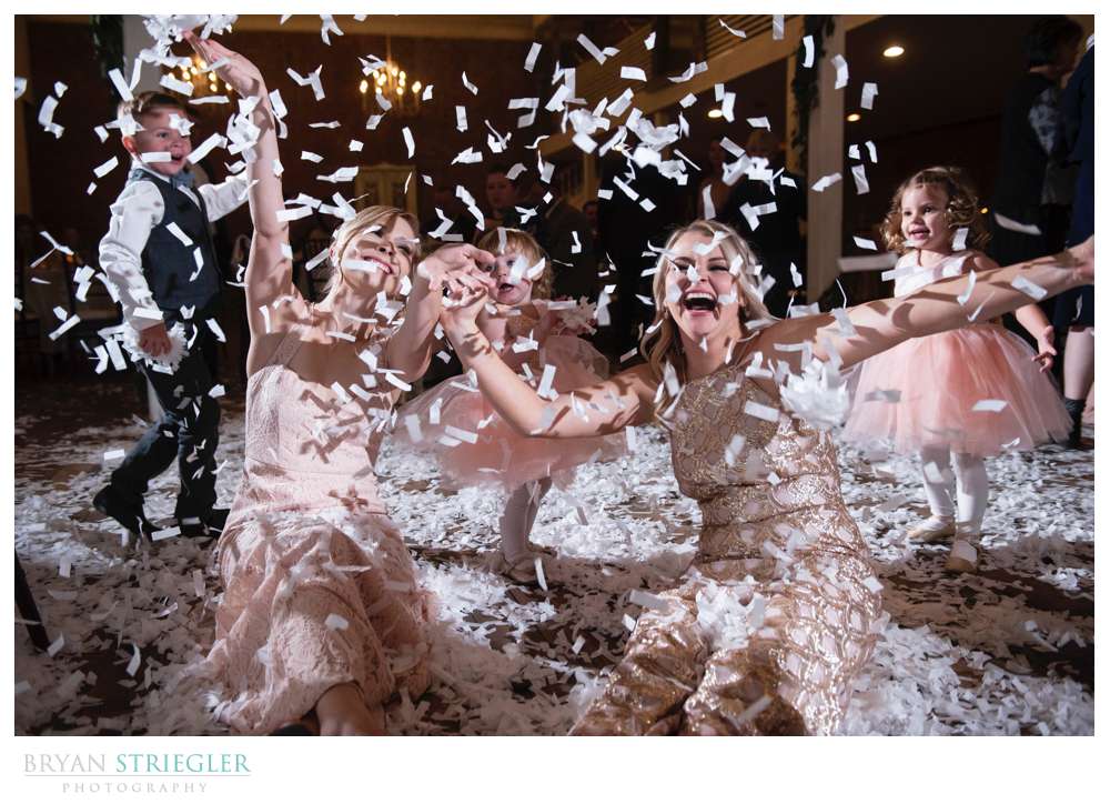 bridesmaids playing in confetti