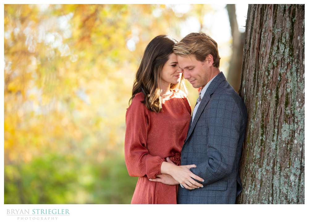 leaning against a tree