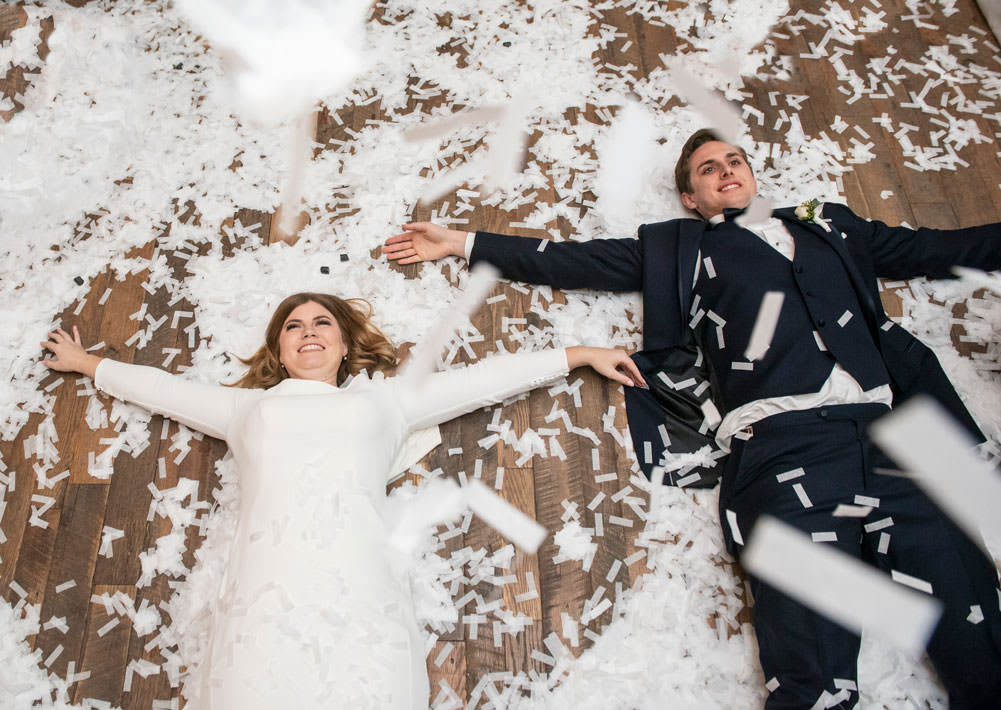 couple making confetti angels