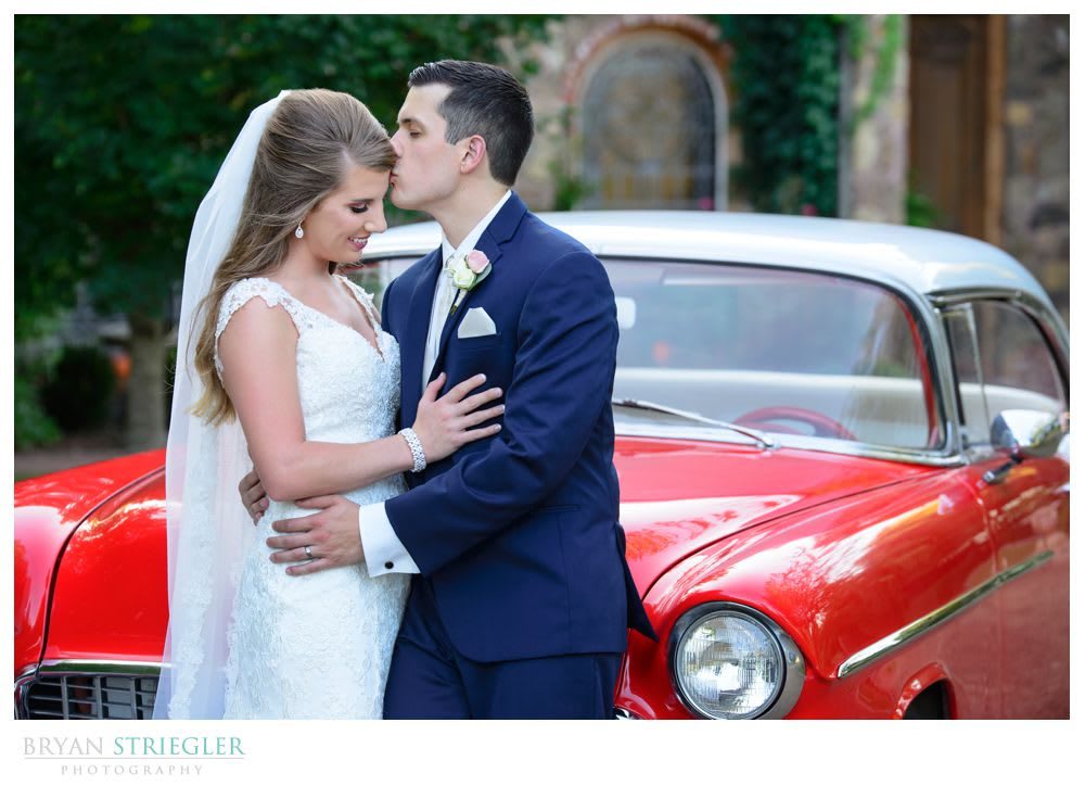 bride and groom with classic car