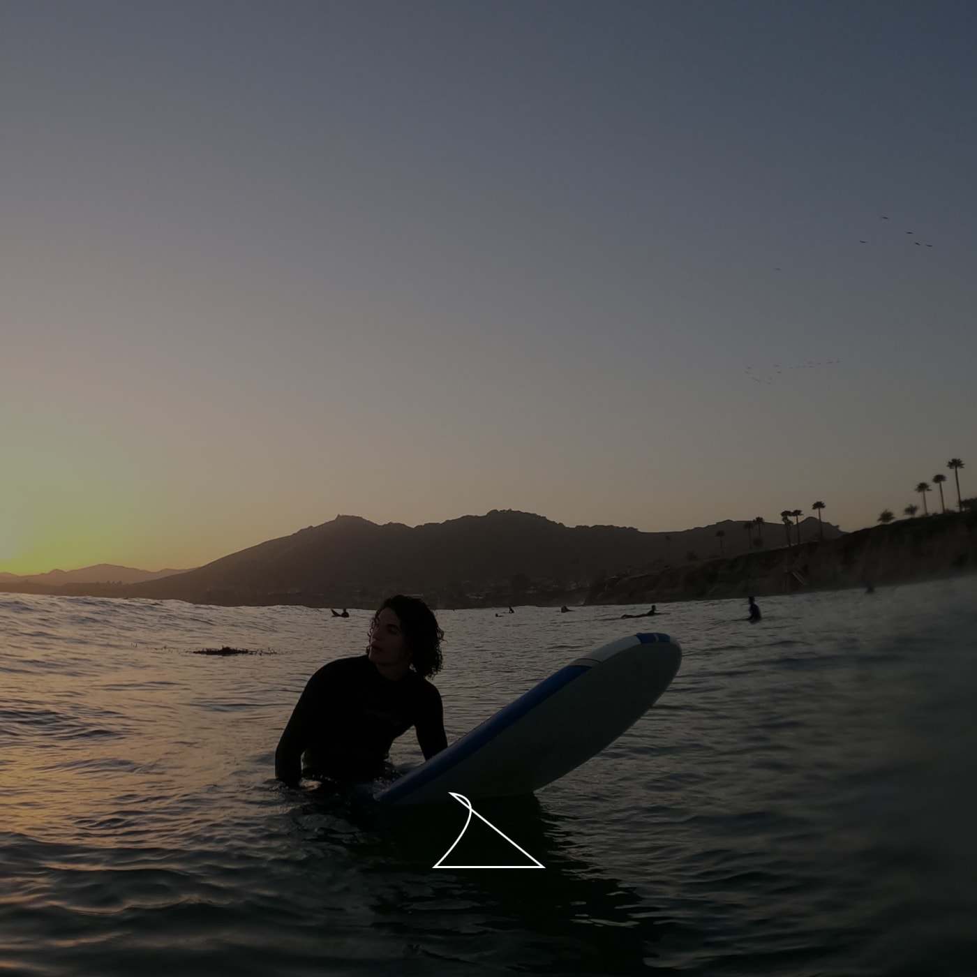 Ocean surf session photographed from shore