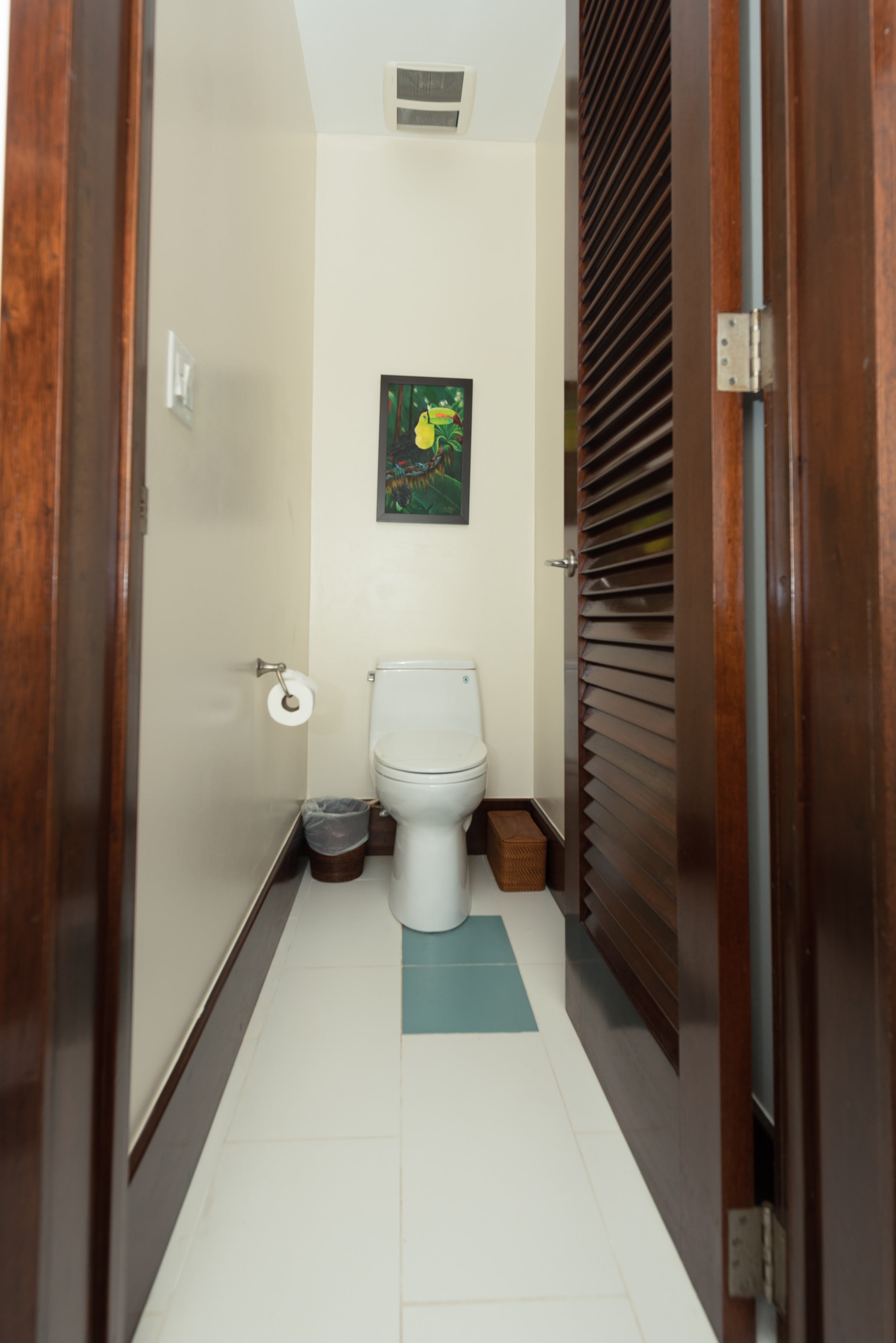 Comfortable bedroom retreat with glass-door patio access and modern wood detailing.