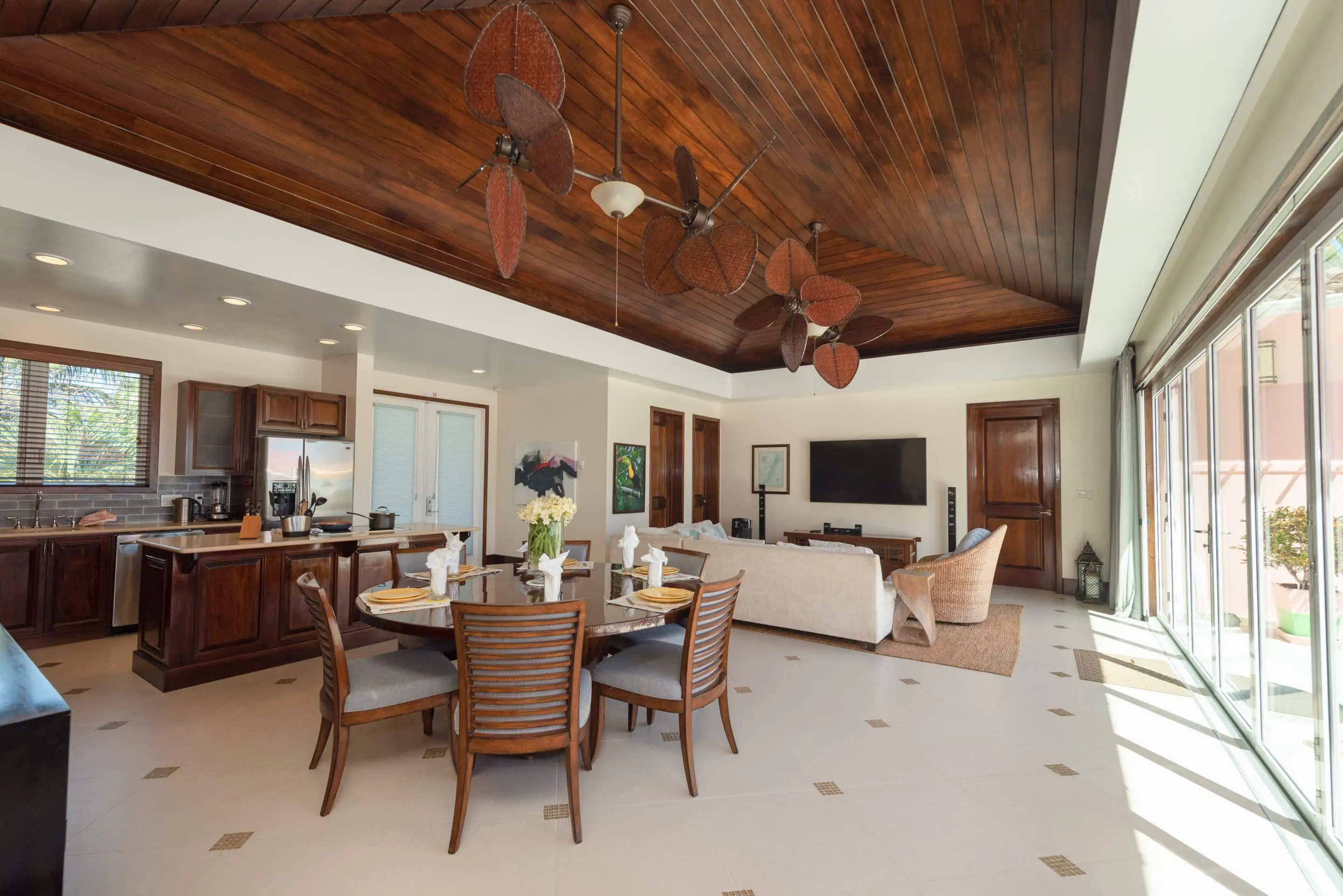 Wide view of the great room with kitchen and dining area