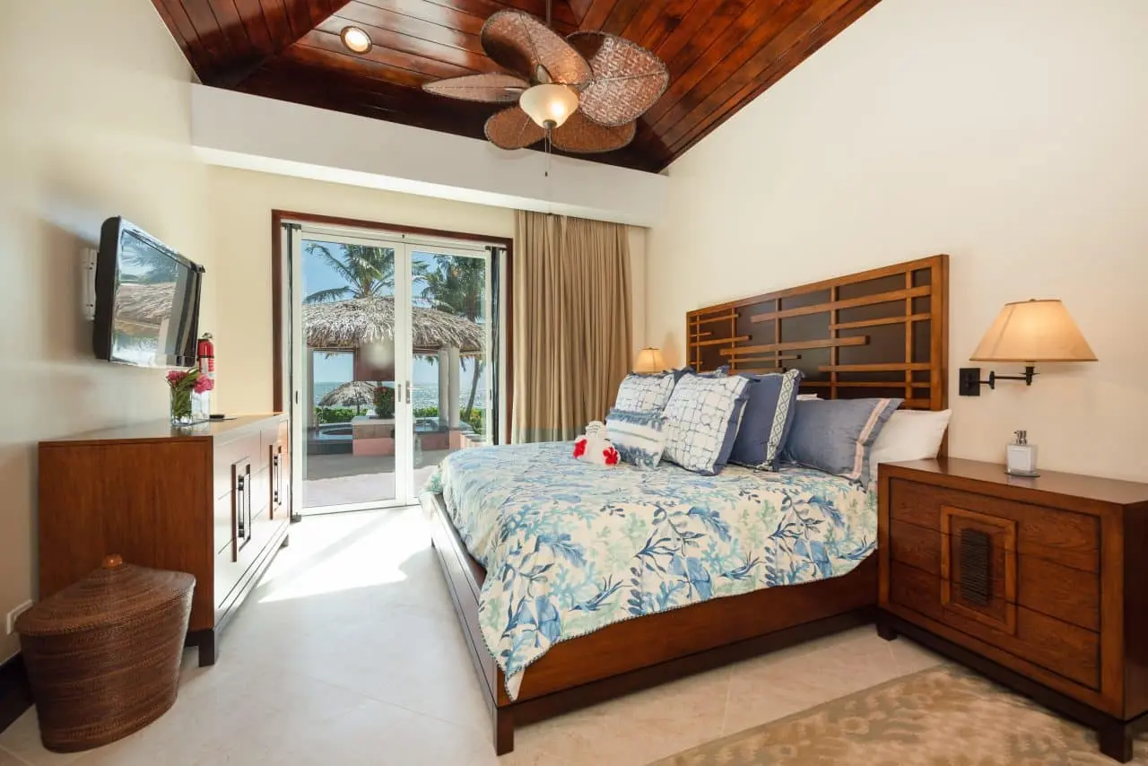 Villa bedroom with pool view and natural light