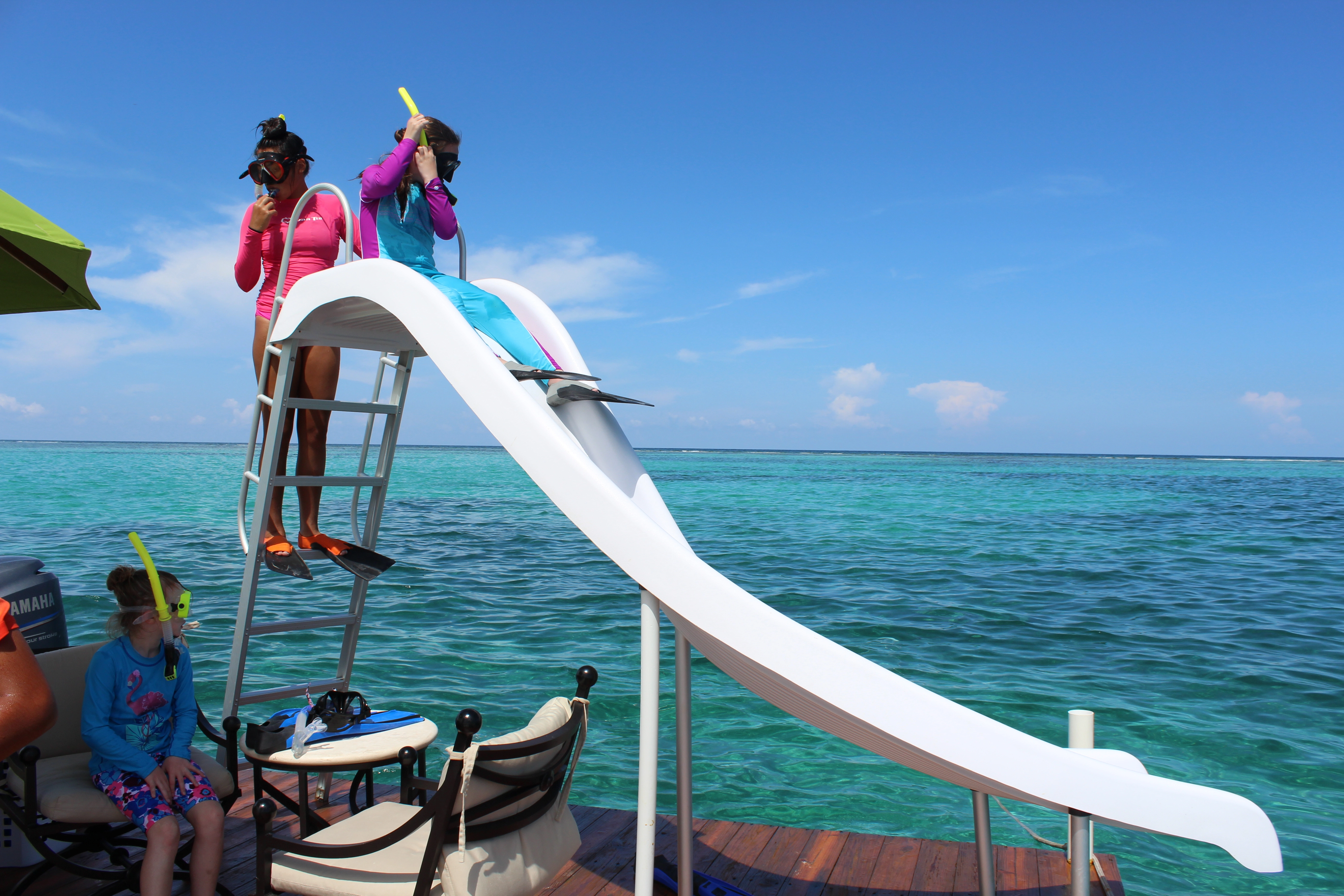 Guest launching from the water slide into the sea