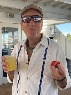 Attendee Hugh smiling and engaged in conversation