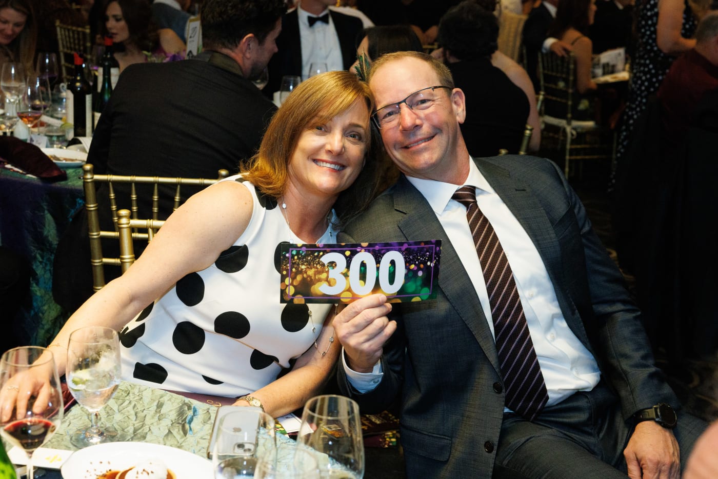 Guests holding their paddle number at the 2025 Advocacy Auction