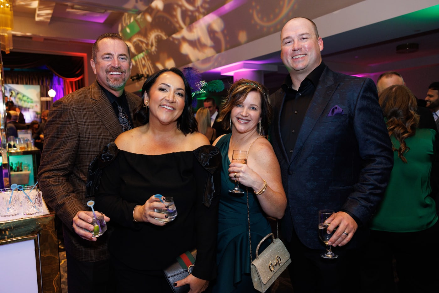 Guests posing together at the cocktail area during the 2025 Advocacy Auction