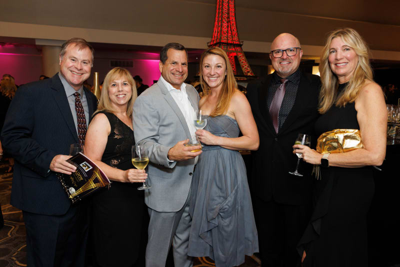 Guests celebrating at the Paris-themed 2023 Auction
