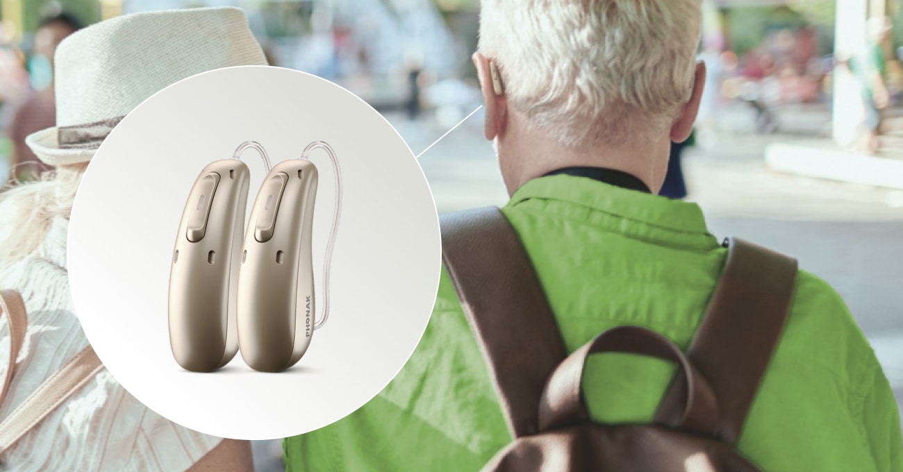 Couple walking and wearing hearing aids